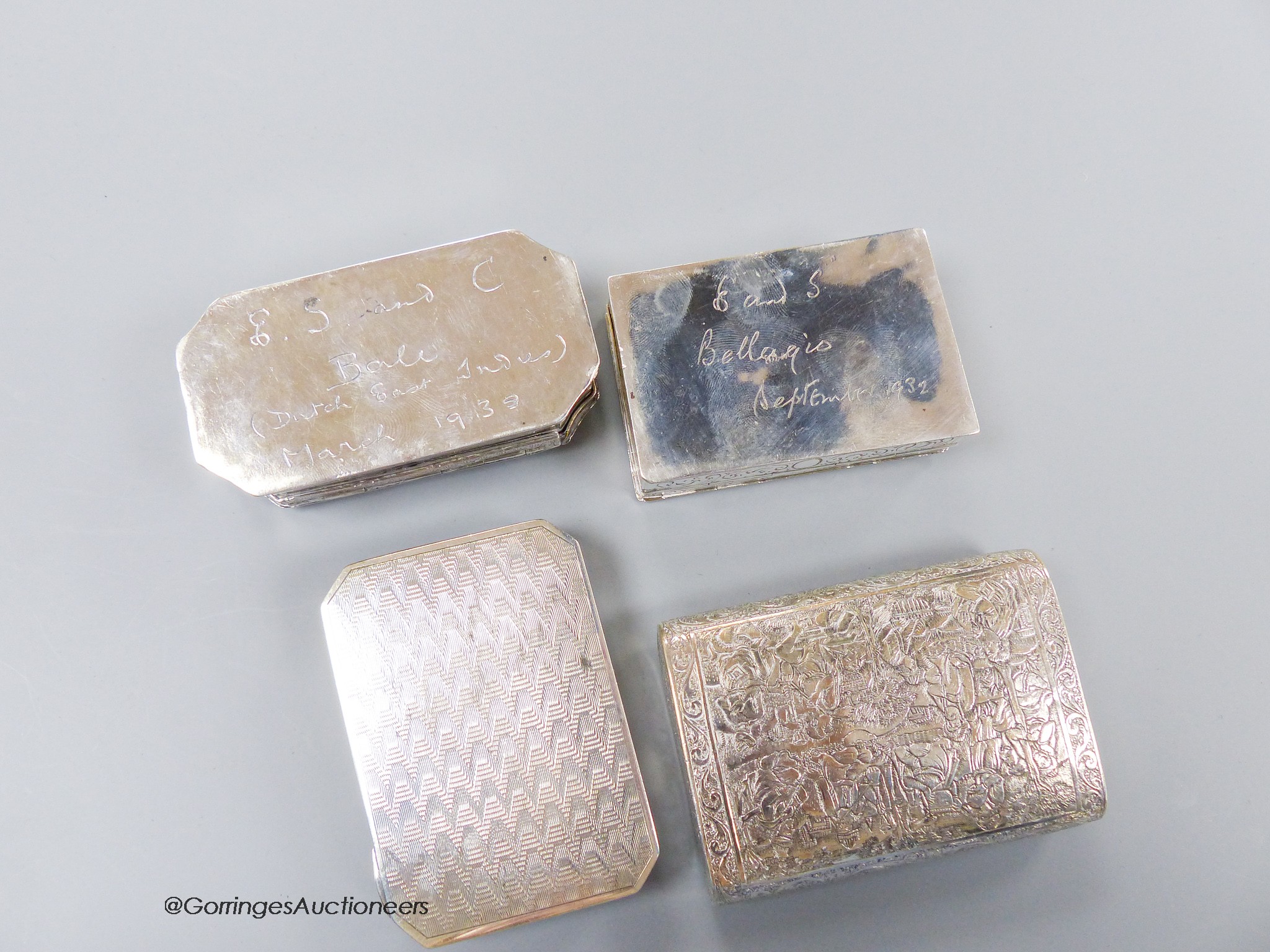 Four assorted 20th century continental white metal snuff boxes, including Middle Easter and one with plique a jour lid, largest 85mm, gross weight 11.6oz.